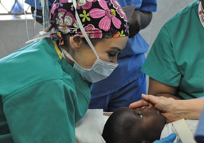 Doctor talking to child during treatment