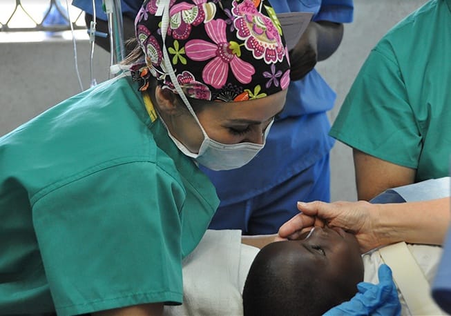 Doctor examining child during mission trip