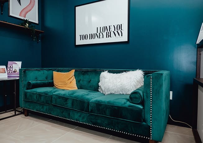Green couch in medical spa reception area